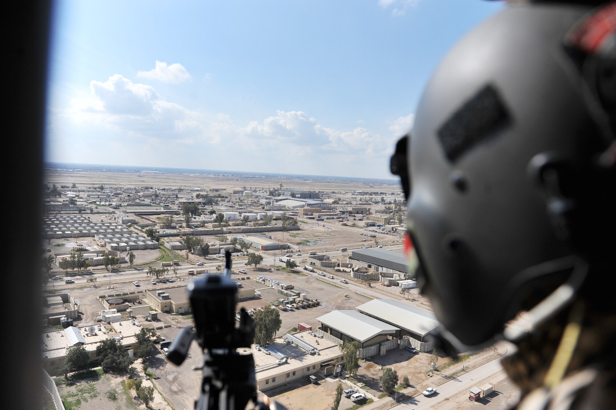 Iraqi Mi-17 helicopter aerial gunner Athier Fiaz scans the area during takeoff March 2, 2010, at Camp Taji, Iraq. (U.S. Air Force photo/Staff Sgt. Quinton Russ)