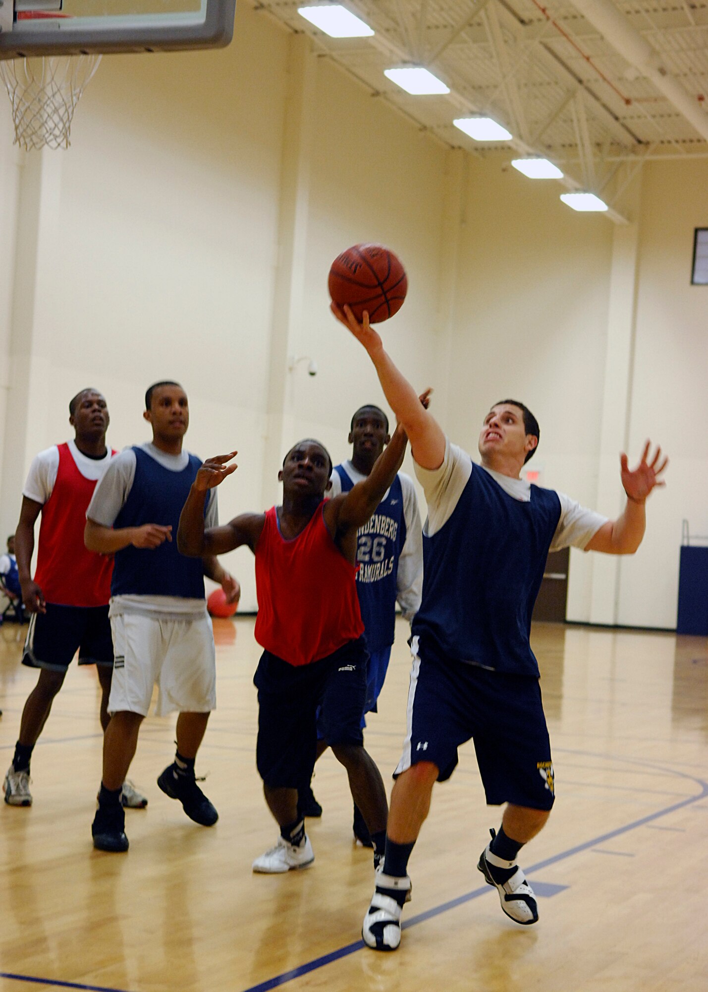 VANDENBERG AIR FORCE BASE, Calif. -- Trying to out-rebound his opponents, 30th Launch Group team member, Jose Robaina reaches for the ball during an intramural basketball play-off game here Monday, March 8, 2010. The 30th LCG outscored the 381st Training Group 72-44. (U.S. Air Force photo/Airman 1st Class Heather R. Shaw)










