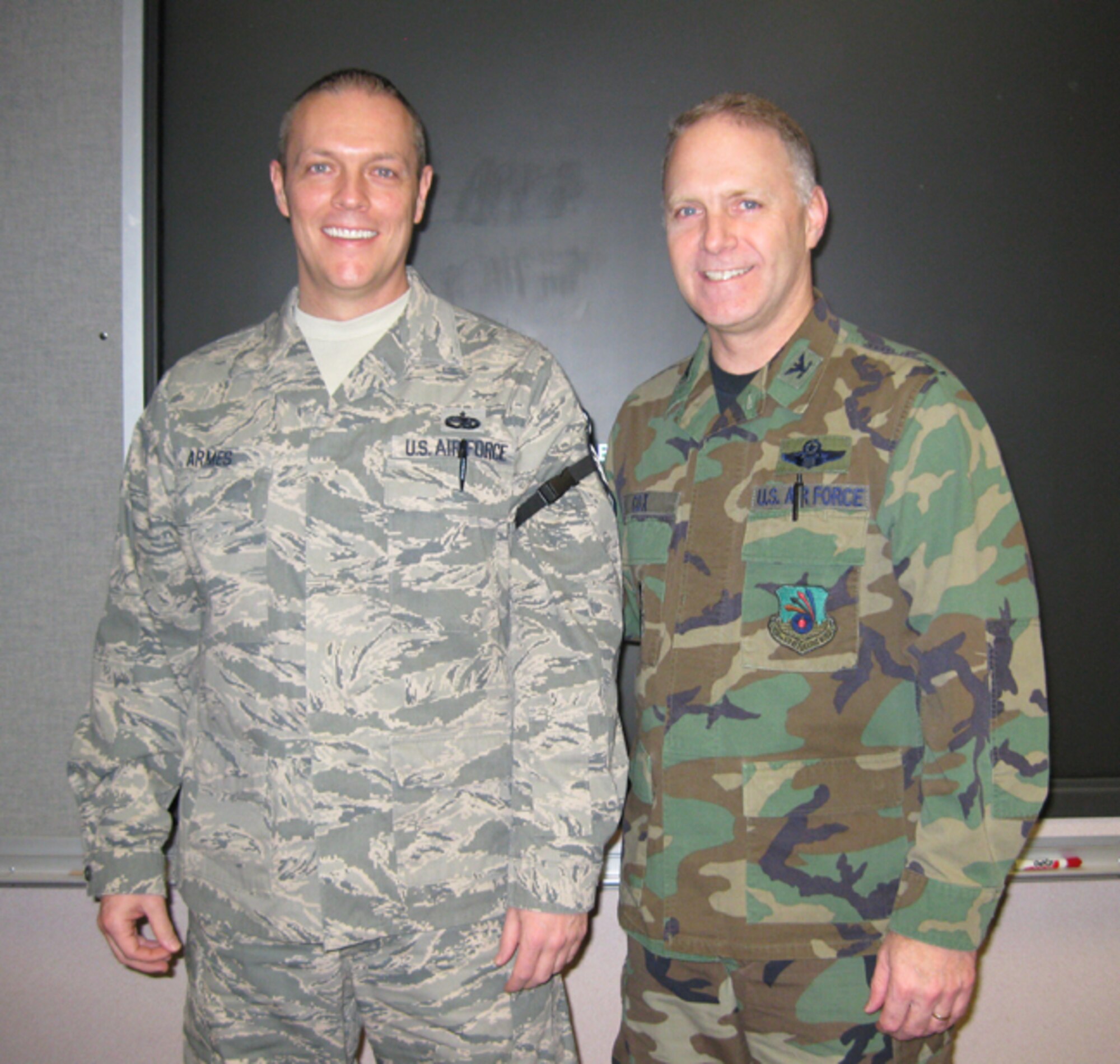 GRISSOM AIR RESERVE BASE, Ind., -- Col. Tom Cox, 434th Air Refueling Wing vice commander, introduces new Master Sgt. Johnny Armes, during a wing staff meeting.  Sergeant Ames was recognized at the meeting for his recent promotion.  (U.S. Air Force photo/Senior Airman Carl Berry)                              