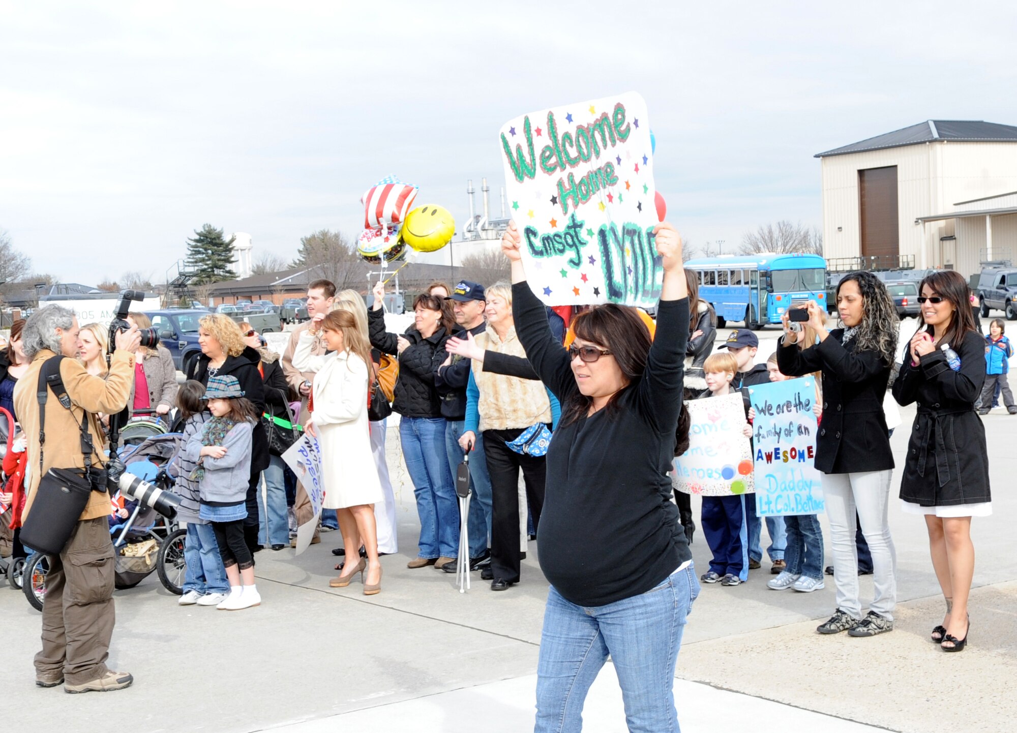 Family members and friends of the 6th Airlift Squadron welcome home 150 Airmen March 2, 2010, at Joint Base McGuire-Dix-Lakehurst, N.J. The squadron staff assumed the role and mission of the 817th Expeditionary Airlift Squadron when they deployed in October 2009 in support of operations Iraqi Freedom and Enduring Freedom. (U.S. Air Force photo/Wayne Russell)