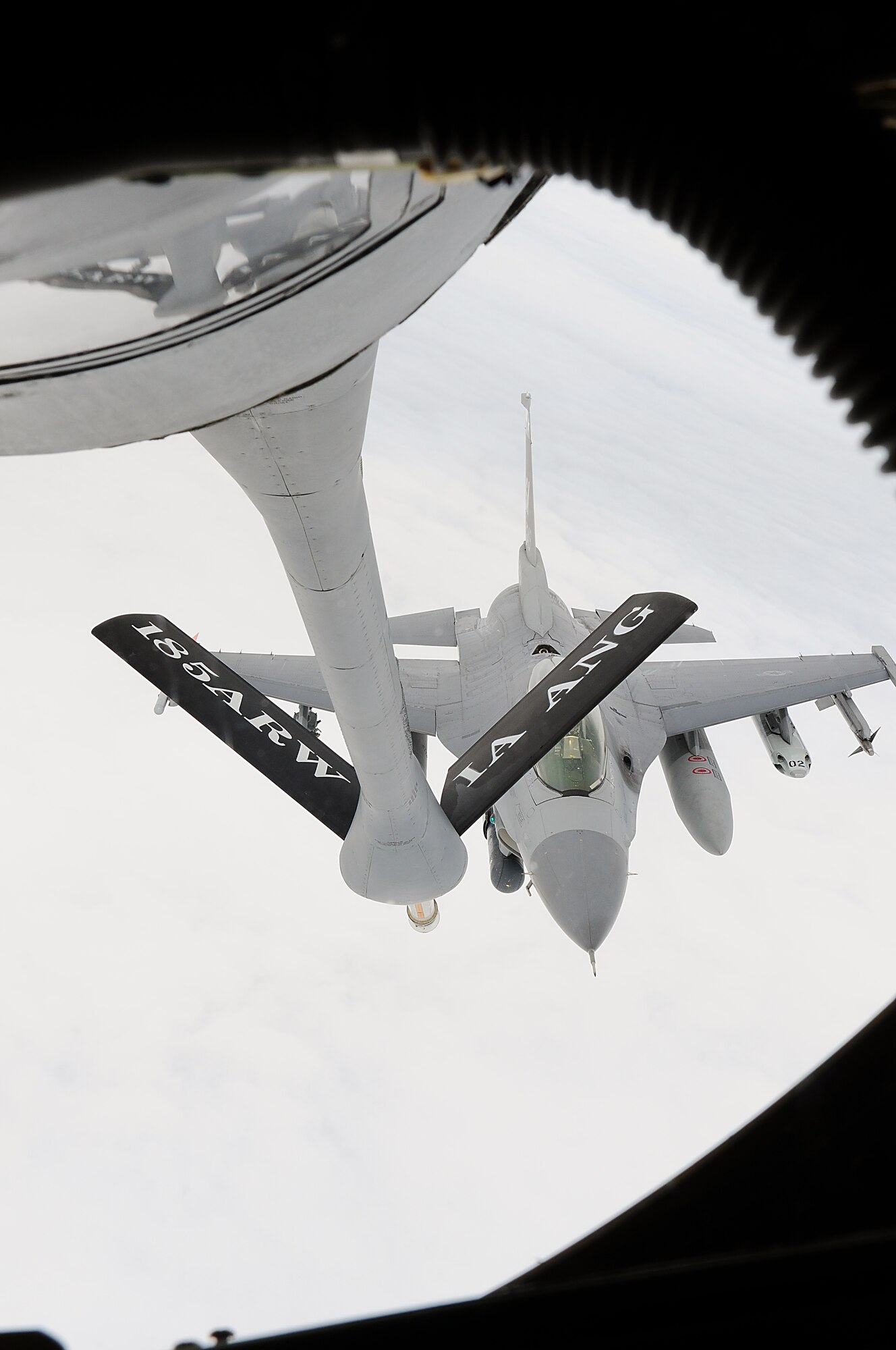 An F-16 assigned to the Texas Air National Guard's 149th Fighter Wing at Lackland Air Force Base, Texas, approaches a KC-135 assigned to the Iowa Air National Guard's 185th Air Refueling Wing for in-flight refueling, over South Texas, on March 6, 2010. (U.S. Air Force photo by Tech. Sgt. Rene Castillo/Released)