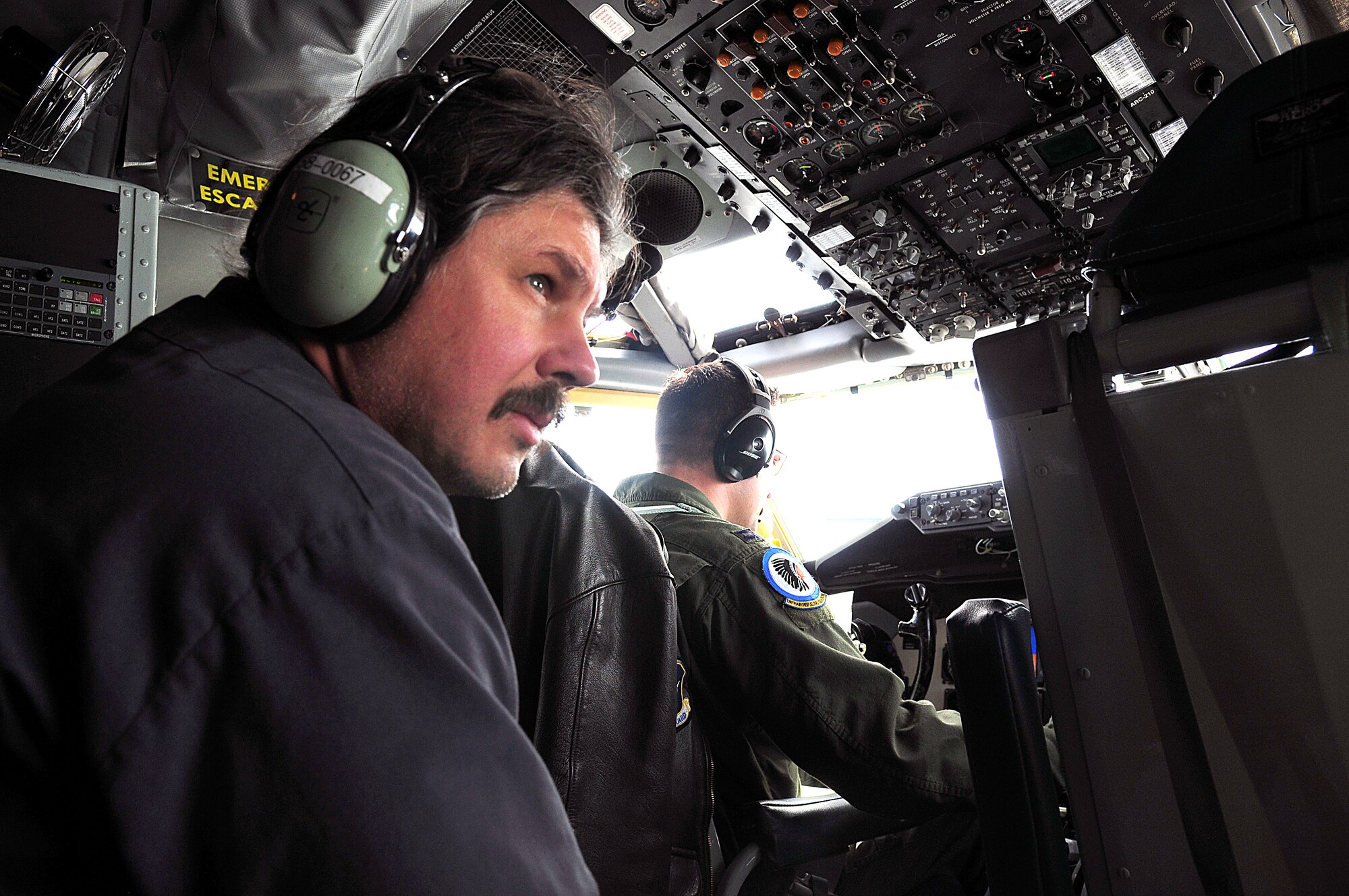 Jed Garmon, the end shop service manager for Cummins Southern Plains' facility in San Antonio, Texas, observes flight operations on a KC-135, as part of a "Boss Lift," which was coordinated with the Employer Support for the Guard and Reserve and the Texas Air National Guard's 149th Fighter Wing, at Lackland Air Force Base, Texas, on March 6, 2010. (U.S. Air Force photo by Tech. Sgt. Rene Castillo/Released)