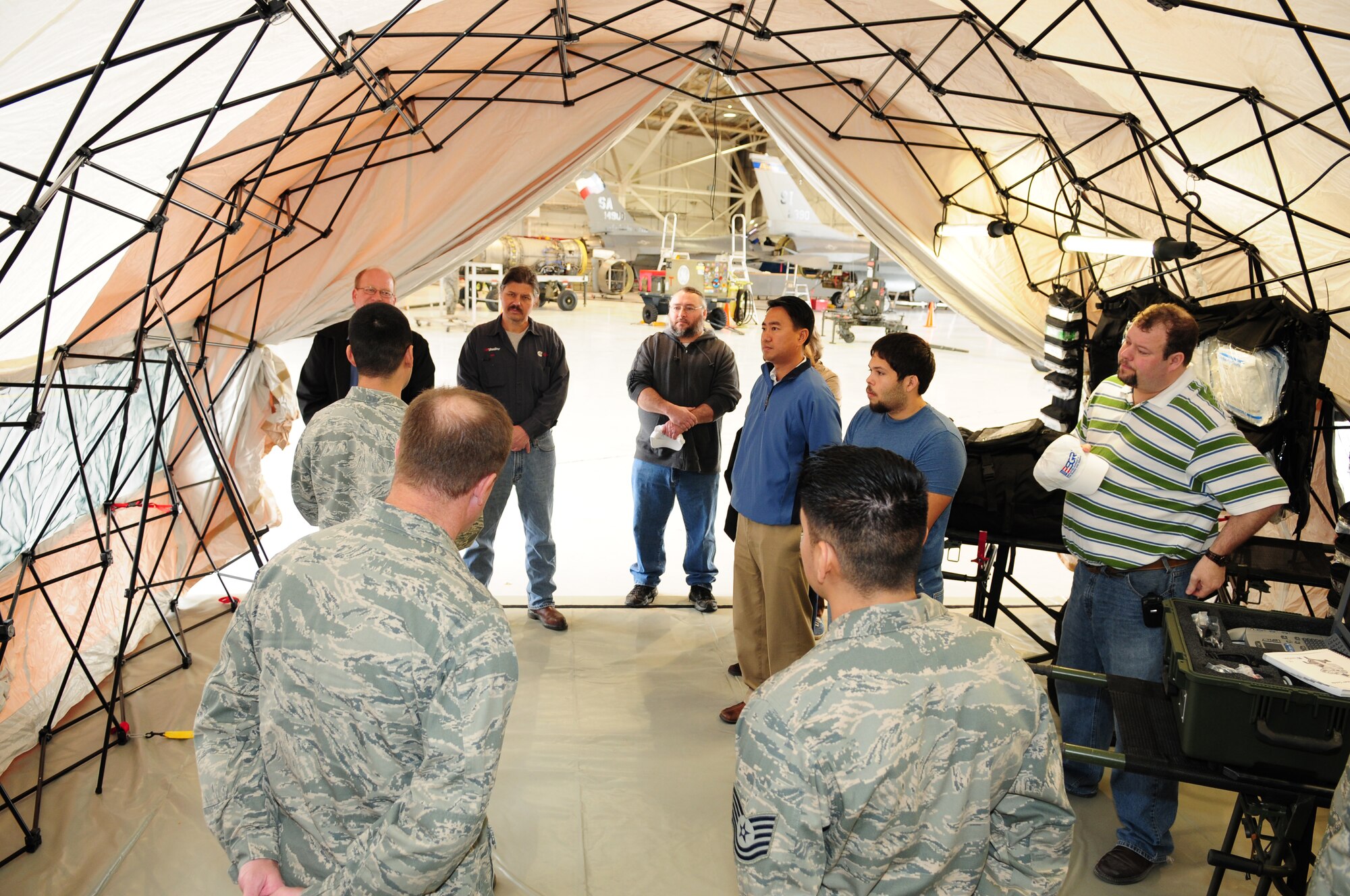 Members of the Texas Air National Guard's 149th Fighter Wing explain the medical capabilities that are used during humanitarian and disaster relief missions to a group of civilian employers of Air National Guard members, as part of a "Boss Lift," which was coordinated with the Employer Support for the Guard and Reserve, at Lackland Air Force Base, Texas, on March 6, 2010. (U.S. Air Force photo by Tech. Sgt. Rene Castillo/Released)