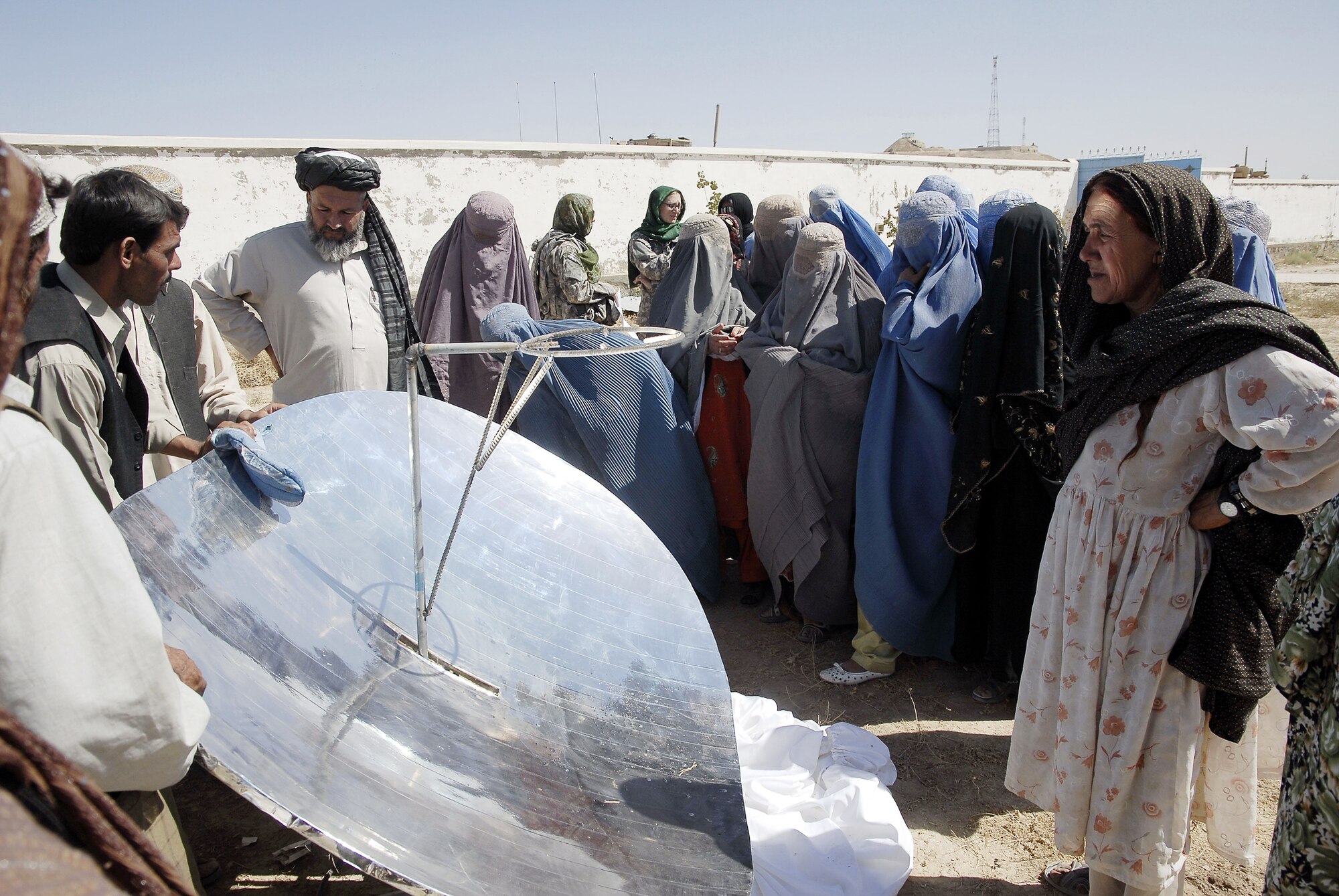Women received solar cookers Sept. 1, 2009 in the Zabul province. Provincial Reconstruction Team Zabul members introduced the solar cooking concept to the Zabul province community, offering new ideas and technology for food preparation. (U.S. Air Force photo/Maj. Elizabeth Erickson)
