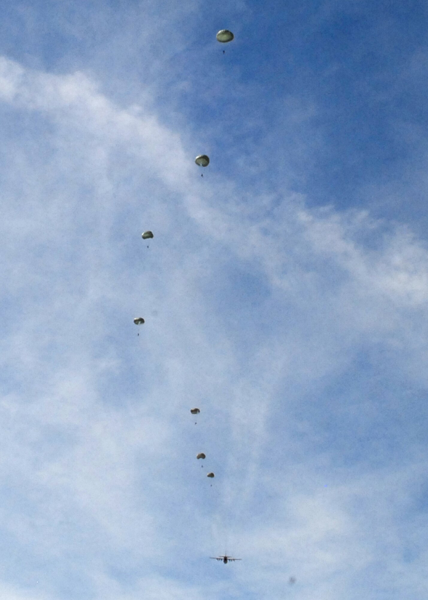 Soldiers from the U.S. Army Civil Affairs and Psychological Operations Command (Airborne) jump from an Air Force C-130 Hercules here March 5. All Soldiers who are certified to jump must perform at least one practice jump every 90 days to maintain their jump status. (Senior Airman William A. O'Brien)