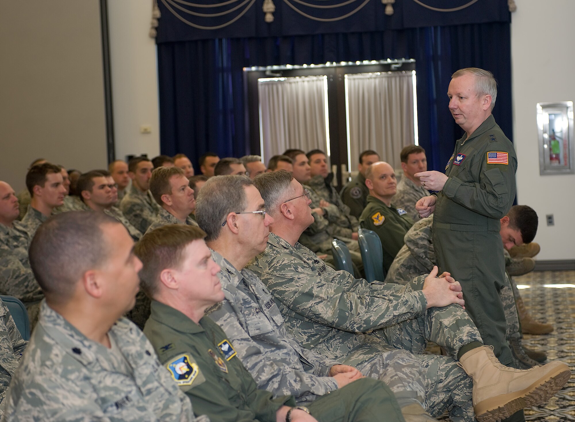 Maj. Gen. Randal Fullhart, director, Global Reach Programs, Office of the Assistant Secretary of the Air Force for Acquisition, Headquarters Air Force, Washington, D.C., briefs on the function of acquisitions and their importance during a town hall meeting  March 4. He spoke about the budget for acquisitions and the process through which they acquire more equipment for the Air Force. (U.S. Air Force photo/Brianne Zimny)