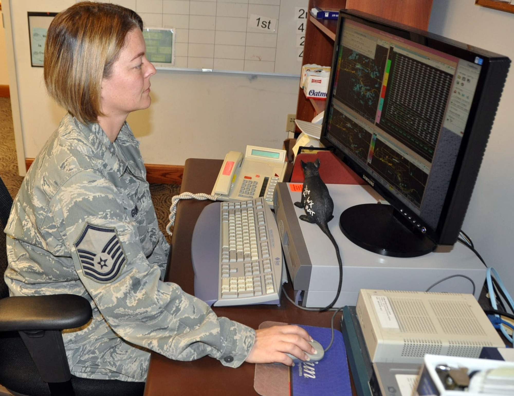 Master Sgt. Lisa R. Gore, Weather Flight Chief, 325th Operations Support Squadron, examines the Doppler radar. (U.S. Air Force photo by Airman 1st Class Rachelle Elsea)