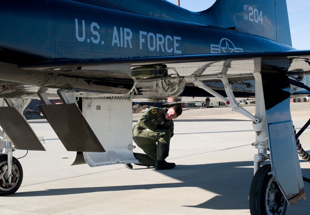 LANGLEY AIR FORCE BASE, Va. – Capt. Scott Crowell, 7th Fighter Squadron pilot, Holloman Air Force Base, N.M., conducts a pre-flight inspection for a T-38A Talon March 5.  The T-38A Talons provide cost-effective offensive and defensive counter air training for F-22 pilots at Langley. Later in March, ACC will establish a site-area task force to explore the possibility of expanding the training program beyond Holloman. (U.S. Air Force photo/Staff Sgt. Barry Loo)