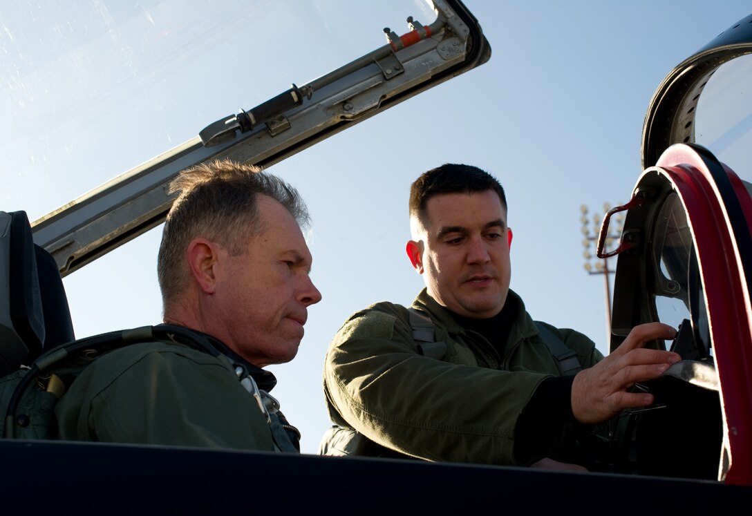 LANGLEY AIR FORCE BASE, Va. - Gen. William M. Fraser III, commander of Air Combat Command, Langley Air Force Base, Va., and Capt. Penn Brown, 49th Fighter Wing Aircrew Flight Equipment officer, Holloman AFB, N.M., conduct a pre-flight inspection in a T 38A Talon March 5.  The T-38A Talons flew more than 80 training sorties over two weeks at Langley. Later in March, ACC will establish a site-area task force to explore the possibility of expanding the training program beyond Holloman. (U.S. Air Force photo/Staff Sgt. Barry Loo)