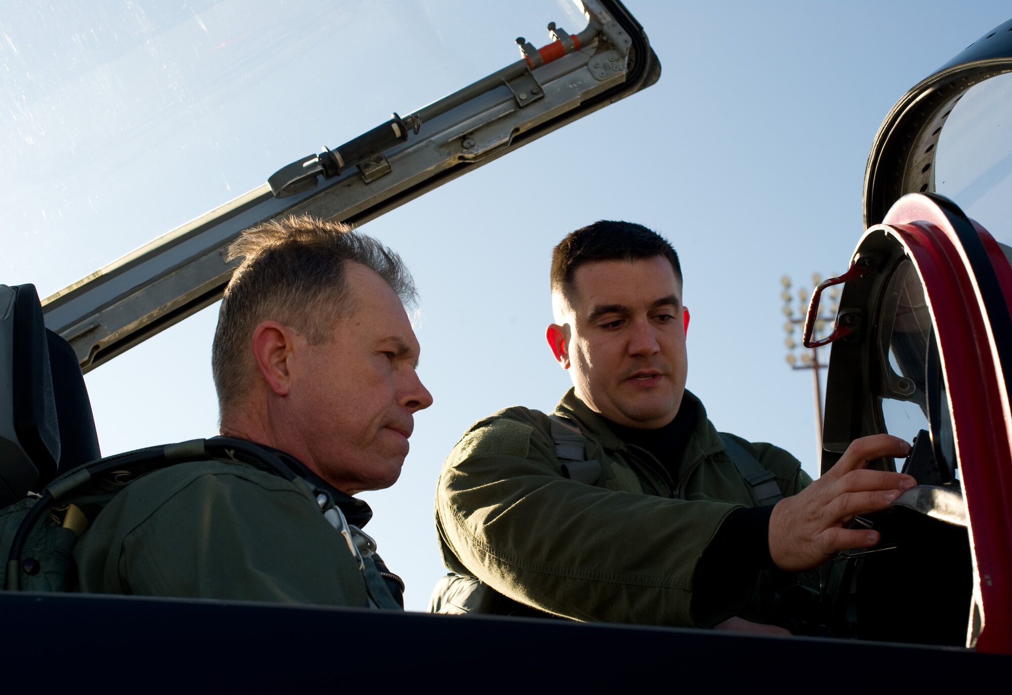 LANGLEY AIR FORCE BASE, Va. - Gen. William M. Fraser III, commander of Air Combat Command, Langley Air Force Base, Va., and Capt. Penn Brown, 49th Fighter Wing Aircrew Flight Equipment officer, Holloman AFB, N.M., conduct a pre-flight inspection in a T 38A Talon March 5.  The T-38A Talons flew more than 80 training sorties over two weeks at Langley. Later in March, ACC will establish a site-area task force to explore the possibility of expanding the training program beyond Holloman. (U.S. Air Force photo/Staff Sgt. Barry Loo)