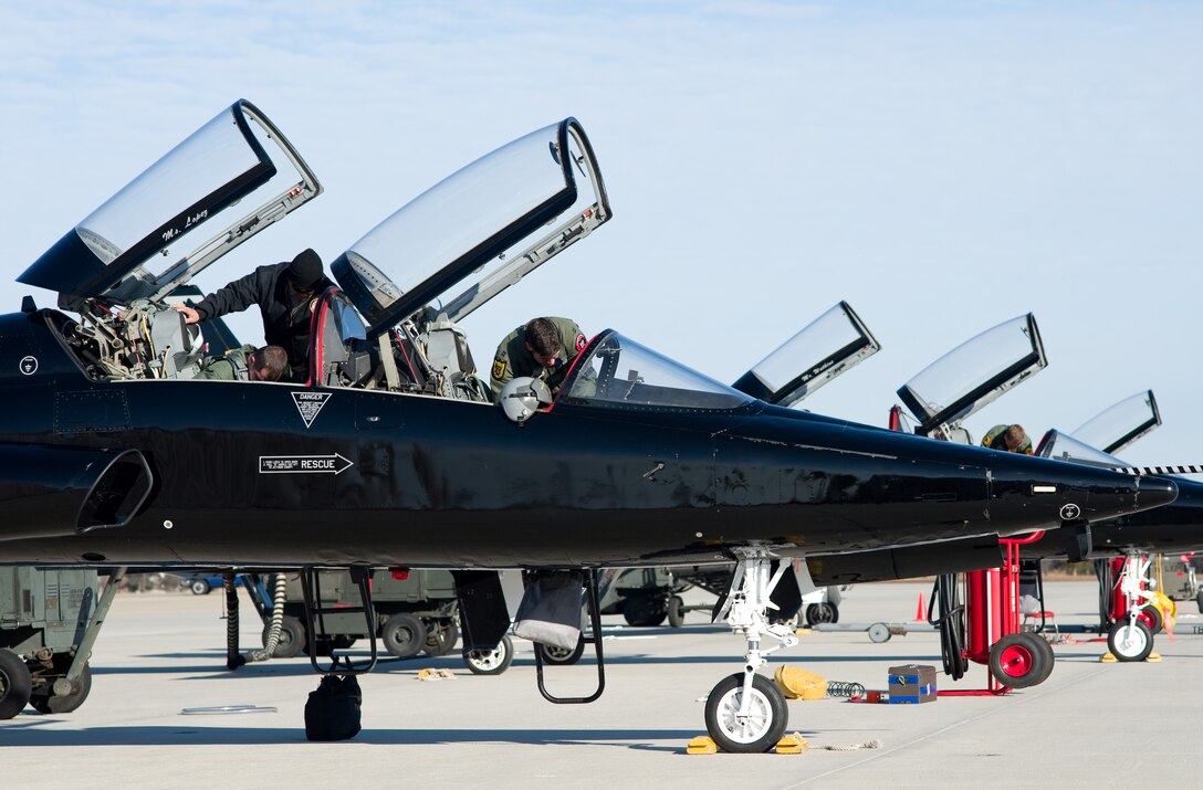 LANGLEY AIR FORCE BASE, Va. – Personnel from the 49th Fighter Wing at Holloman Air Force Base, N.M., conduct pre-flight inspections on T-38A Talons March 5.  The 49 FW sent Talons, pilots and support crew to Langley for aerial combat training against F-22 Raptors. Later in March, ACC will establish a site-area task force to explore the possibility of expanding the training program beyond Holloman. (U.S. Air Force photo/Staff Sgt. Barry Loo)