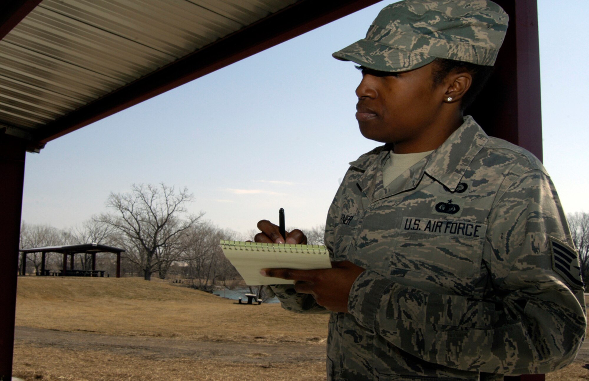 U.S. Air Force Staff Sgt. Quarteeya Garner, 22nd Contracting Squadron simplified acquisition member, annotates notes for the gazebo project at the Kruger Recreation Area March 5, 2010, at McConnell Air Force Base, Kan. The simplified acquisition team works with off base contractors and 22nd Civil Engineer Squadron to manage all building projects.  (U.S. Air Force photo/ Airman 1st Class Andrea Salazar)