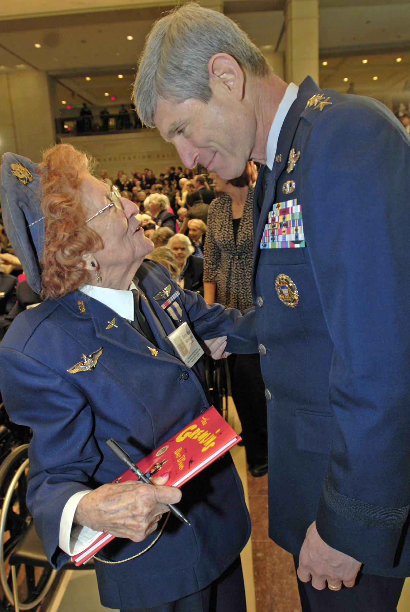 Betty Wall Strohfus, a Women Airforce Service Pilot from Minnesota, talks with Air Force Chief of Staff Gen. Norton Schwartz at the Congressional Gold Medal ceremony at the Capitol March 10, 2010. More than 200 WASPs attended the event, many of them wearing their World War II-era uniforms. The audience, which Speaker Nancy Pelosi noted was one of the largest ever in the Capitol and too large to fit into Emancipation Hall, also included their families, as well as the families of those who have since died or couldn't travel. (U.S. Air Force photo/Staff Sgt. J.G. Buzanowski)

