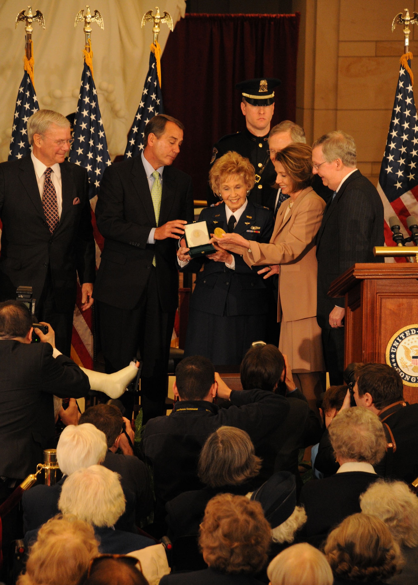 Deanie Parrish, Woman Airforce Service Pilot, center, accepts the Congressional Gold Medal on behalf of her fellow WASP, more than 170 of which assembled below to watch, during a ceremony recognizing the female aviators for their service during World War II at the Capitol building in Washington D.C. March 10, 2010. A number of Joint Team Andrews Airmen volunteered to escort the WASP and presented each of them with their Congressional Gold Medal in a private ceremony. The medal used during the presentation was donated to the Smithsonian Institution as a historic and educational piece. (U.S. Air Force photo by Airman 1st Class Kat Lynn Justen)