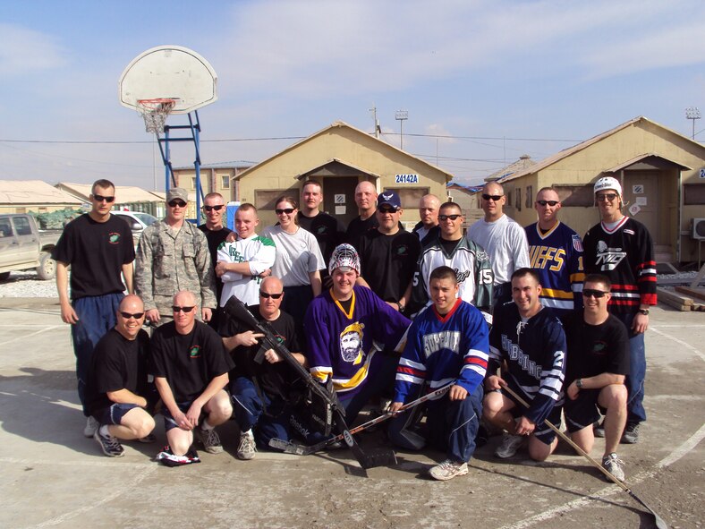 148th Fighter Wing Civil Engineering members deployed to the 455th Expeditionary Civil Engineering Squadron at Bagram Airfield, Afghanistan pose for a photo on Sunday, March 7th, 2010 during a floor hockey tournament held in honor of the 2010 Minnesota High School State Hockey Tournament.  (Photo by MN National Guard)