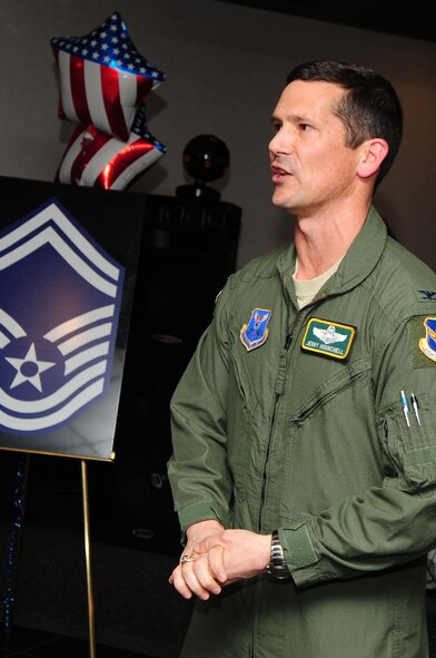 BARKSDALE AIR FORCE BASE, La. -- Col. Gerald Hounchell, 2d Bomb Wing vice commander, congratulates Barksdale's newest senior master sergeants during the senior master sergeant selection party held at the Stripes Club March 9. (U.S. Air Force photo by Senior Airman Joanna M. Kresge)