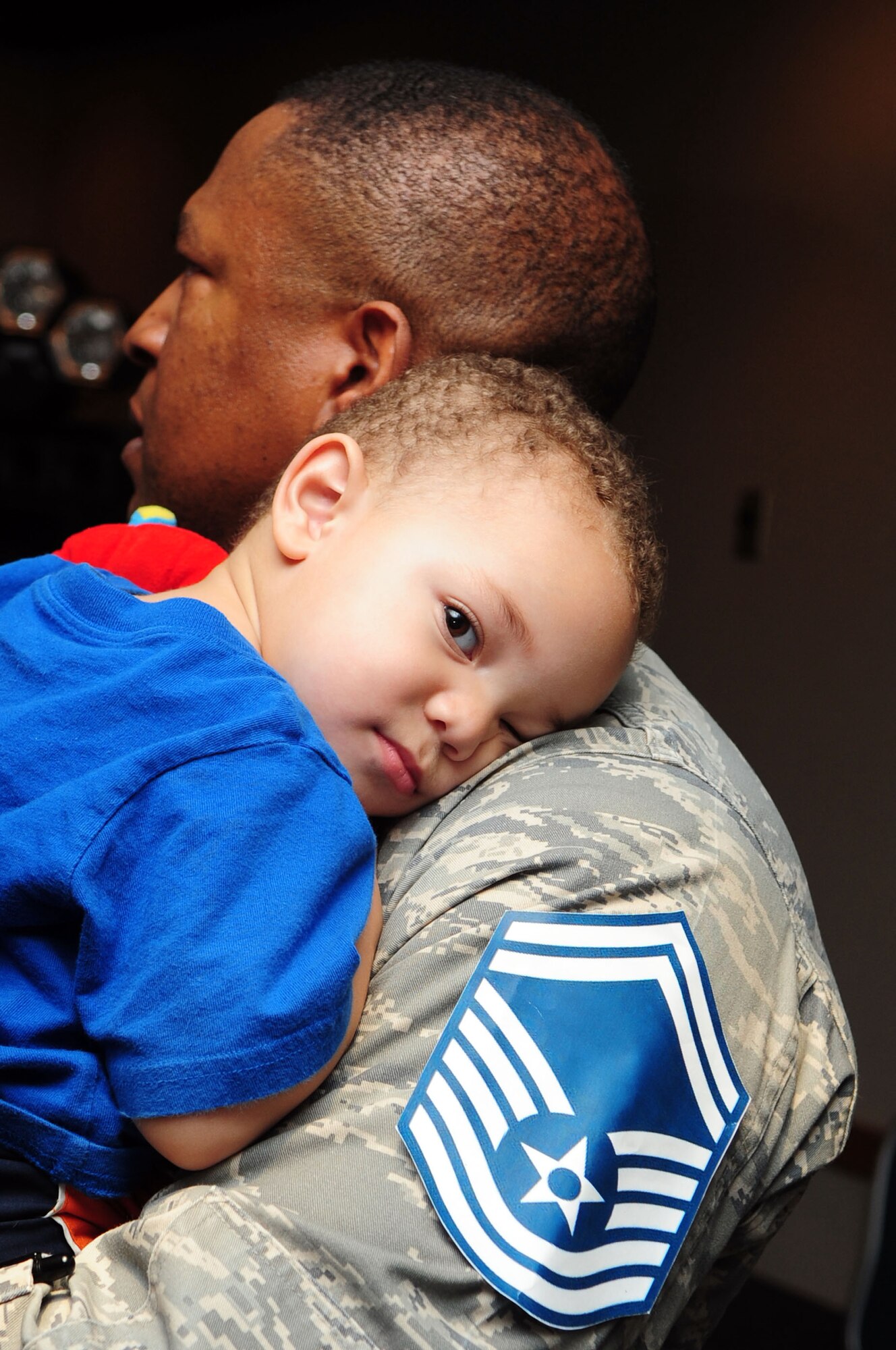 BARKSDALE AIR FORCE BASE, La. -- Master Sgt. Kevin Beasley, Air Force Global Strike Command, holds his son, Nathanael, during the senior master sergeant select party held at the Stripes Club March 9. (U.S. Air Force photo by Senior Airman Joanna M. Kresge)