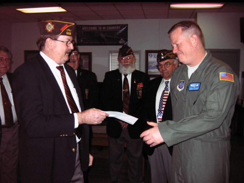 The Veterans of Foreign Wars' National Commander, Tommy Tradewell, visited Dover Air Force Base on February 26. During this visit members of the Camden VFW Post 3238 presented $1500 to the Dover AFB First Sergrant's Good Sheppard fund. The Camden VFW Commander Morris Arnett is handing the check over to Senior Master Sgt. Eric Getz, 9th Airlift Squadron First Sergeant. Behind them, from left to right, is Paul Phillips, Jr., VFW Delaware State Adjutant, Samuel Atkins, VFW Delaware State Commander, Jesse Kitson, VFW Delaware State Quartermaster, Ted Mariner, VFW Delaware State Chief of Staff. (Curtesy photo)