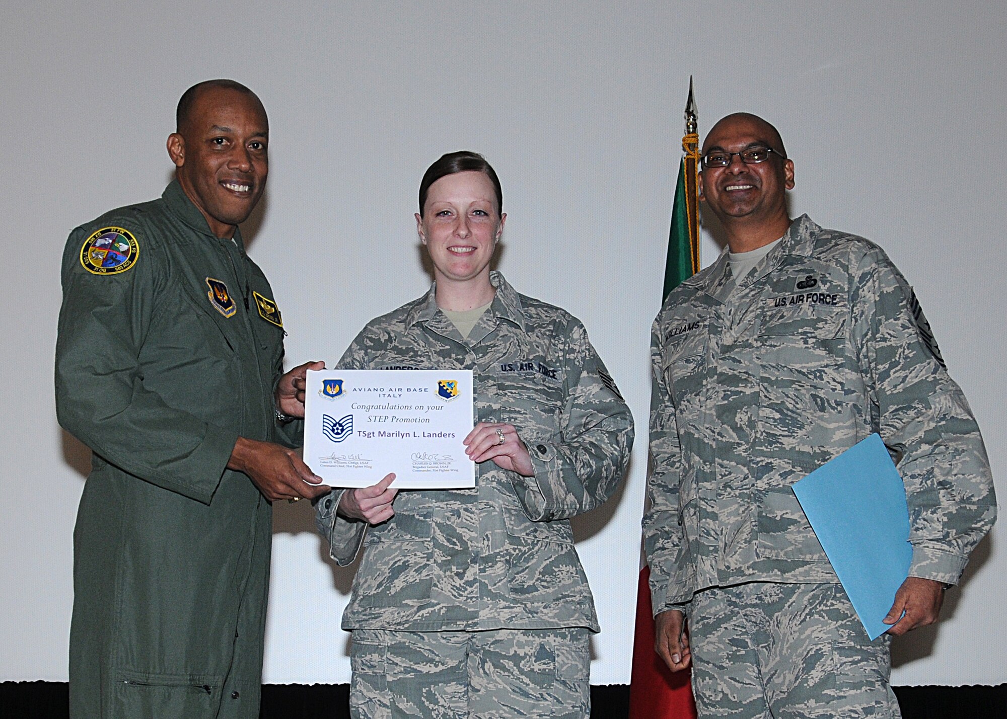 Staff Sgt. Marilyn Landers, 31st Logistics Readiness Squadron, is STEP promoted by Brig. Gen. Charles Q. Brown Jr., 31st Fighter Wing commander, and Chief Master Sgt. Laten Williams, 31st FW command chief, Feb. 25, 2010, at the 31st Logistics Readiness Squadron commander’s call.  Tech. Sgt. Landers was promoted under the Stripes for Exceptional Performers Program. (U.S. Air Force photo/Senior Airman Tabitha M. Mans)