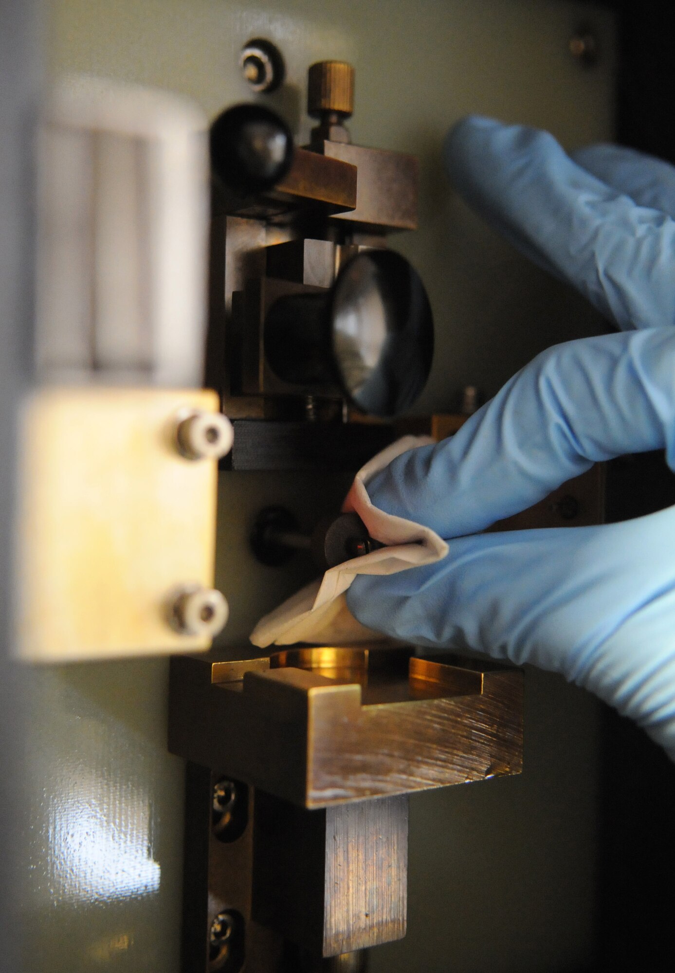 RAF MILDENHALL, England – Airman Josh Ouchie, 100th Maintenance Group Non-Destructive Inspection technician, prepares the Spectral M machine to analyze aircraft engine oil samples at the NDI shop March 9. (U.S. Air Force photo/ Staff Sgt. Jerry Fleshman)