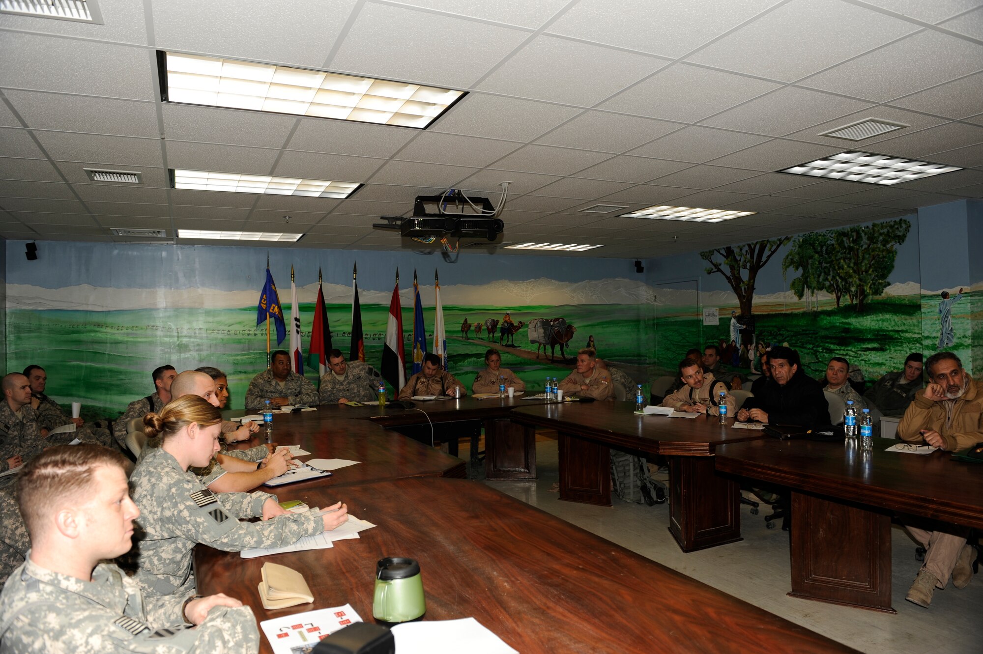 Afghan National Army Air Corps and coalition forces attend a meeting at the Craig Joint Theater Hospital, Bagram Airfield, Afghanistan, March 6, 2010. During this meeting Afghan and coalition forces discussed the evolution of the medical evacuation mission in Afghanistan. (U.S. Air Force photo by/ Tech. Sgt. Jeromy K. Cross/released)