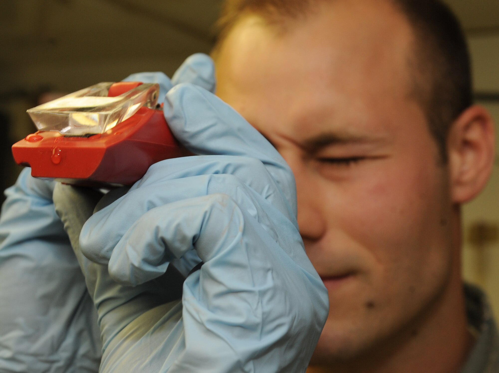 Staff Sgt. Dustyn Marek, 506th Expeditionary Logistics Readiness Squadron fuels laboratory technician, tests fuel quality at Kirkuk Regional Air Base, Iraq on March 6, 2010.   Sergeant Marek samples the fuel to make sure it's up to military specifications.  Sergeant Marek is deployed from McChord AFB, Wash.  (U.S. Air Force photo/Staff Sgt. Tabitha Kuykendall/Released)	 