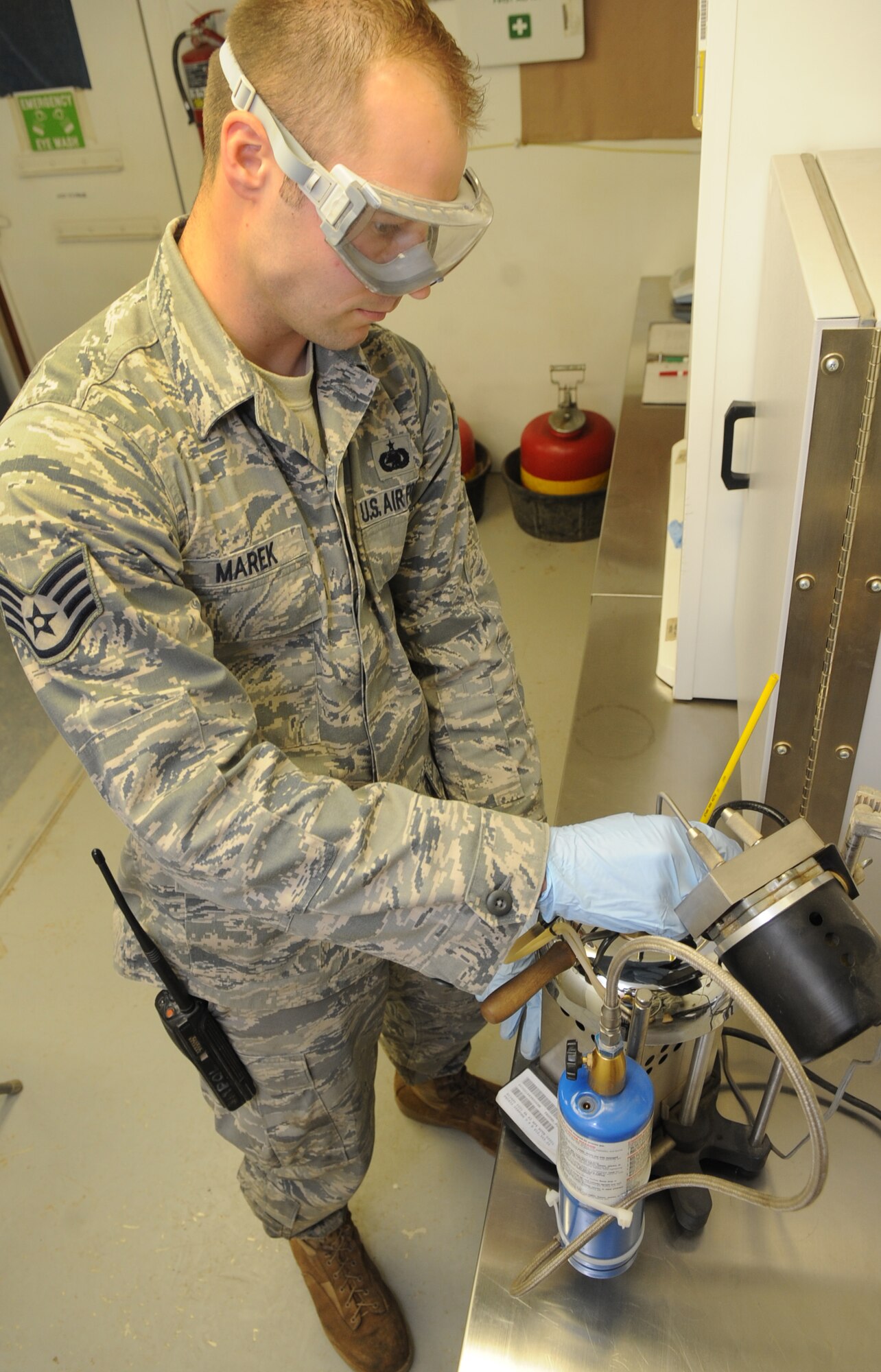 Staff Sgt. Dustyn Marek, 506th Expeditionary Logistics Readiness Squadron fuels laboratory technician, tests fuel quality at Kirkuk Regional Air Base, Iraq on March 6, 2010.   Sergeant Marek samples the fuel to make sure it's up to military specifications.  Sergeant Marek is deployed from McChord AFB, Wash.  (U.S. Air Force photo/Staff Sgt. Tabitha Kuykendall/Released)	 