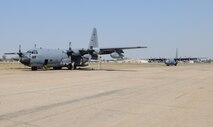 PHNOM PENH, Kingdom of Cambodia -- Maintainers from the 353rd Maintenance Squadron perform preflight inspections two MC-130P Combat Shadows here Feb. 24. Airmen from the 353rd Special Operations Group deployed here Feb. 21-24 to support a training exercise between U.S. Army Special Forces and Royal Cambodian Armed Forces National Counter-Terrorism Special Forces. (U.S. Air Force photo by Tech. Sgt. Aaron Cram)