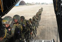 Members of the Royal Cambodian Armed Forces march into a MC-130P Combat Shadow here Feb. 22 for the first-ever combined jump between U.S. and RCAF soldiers. More than 90 U.S. and RCAF soldiers participated in the friendship jump. U.S. Army Special Forces spent five weeks training the fledgling RCAF National Counter-Terrorism Special Forces during a combined training exercise. (U.S. Air Force photo by Tech. Sgt. Aaron Cram)