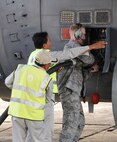PHNOM PENH, Kingdom of Cambodia -- Airman 1st Class Brandon Swanner, a crew chief with the 353rd Maintenance Squadron, fuels up a MC-130P Combat Shadow here Feb. 22. Airmen from the 353rd Special Operations Group deployed here Feb. 21-24 to support a training exercise between U.S. Army Special Forces and Royal Cambodian Armed Forces National Counter-Terrorism Special Forces. (U.S. Air Force photo by Tech. Sgt. Aaron Cram)