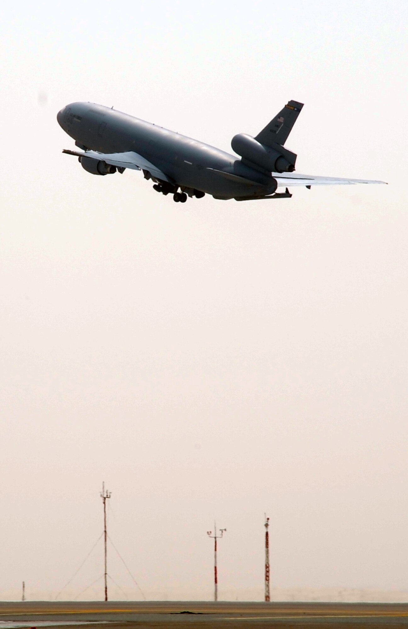 A flight crew drive a KC-10 Extender from the 908th Expeditionary Air Refueling Squadron into the air en route to a mission during operations on the flightline for the 380th Air Expeditionary Wing at a non-disclosed base in Southwest Asia on March 1, 2010. The 380th AEW supports operations Iraqi Freedom and Enduring Freedom and the Combined Joint Task Force-Horn of Africa. (U.S. Air Force Photo/Master Sgt. Scott T. Sturkol/Released)