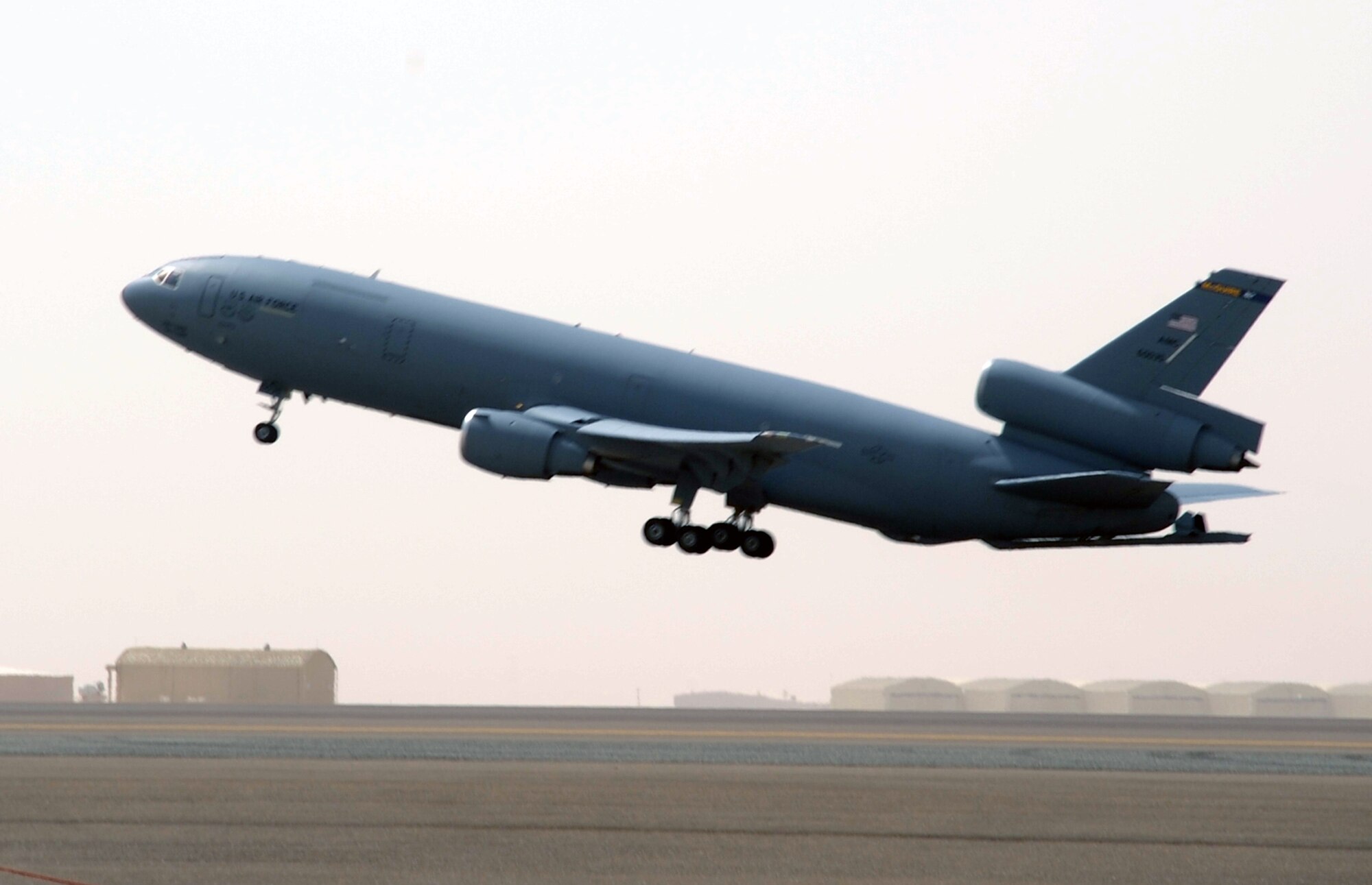 A flight crew drive a KC-10 Extender from the 908th Expeditionary Air Refueling Squadron into the air en route to a mission during operations on the flightline for the 380th Air Expeditionary Wing at a non-disclosed base in Southwest Asia on March 1, 2010. The 380th AEW supports operations Iraqi Freedom and Enduring Freedom and the Combined Joint Task Force-Horn of Africa. (U.S. Air Force Photo/Master Sgt. Scott T. Sturkol/Released)