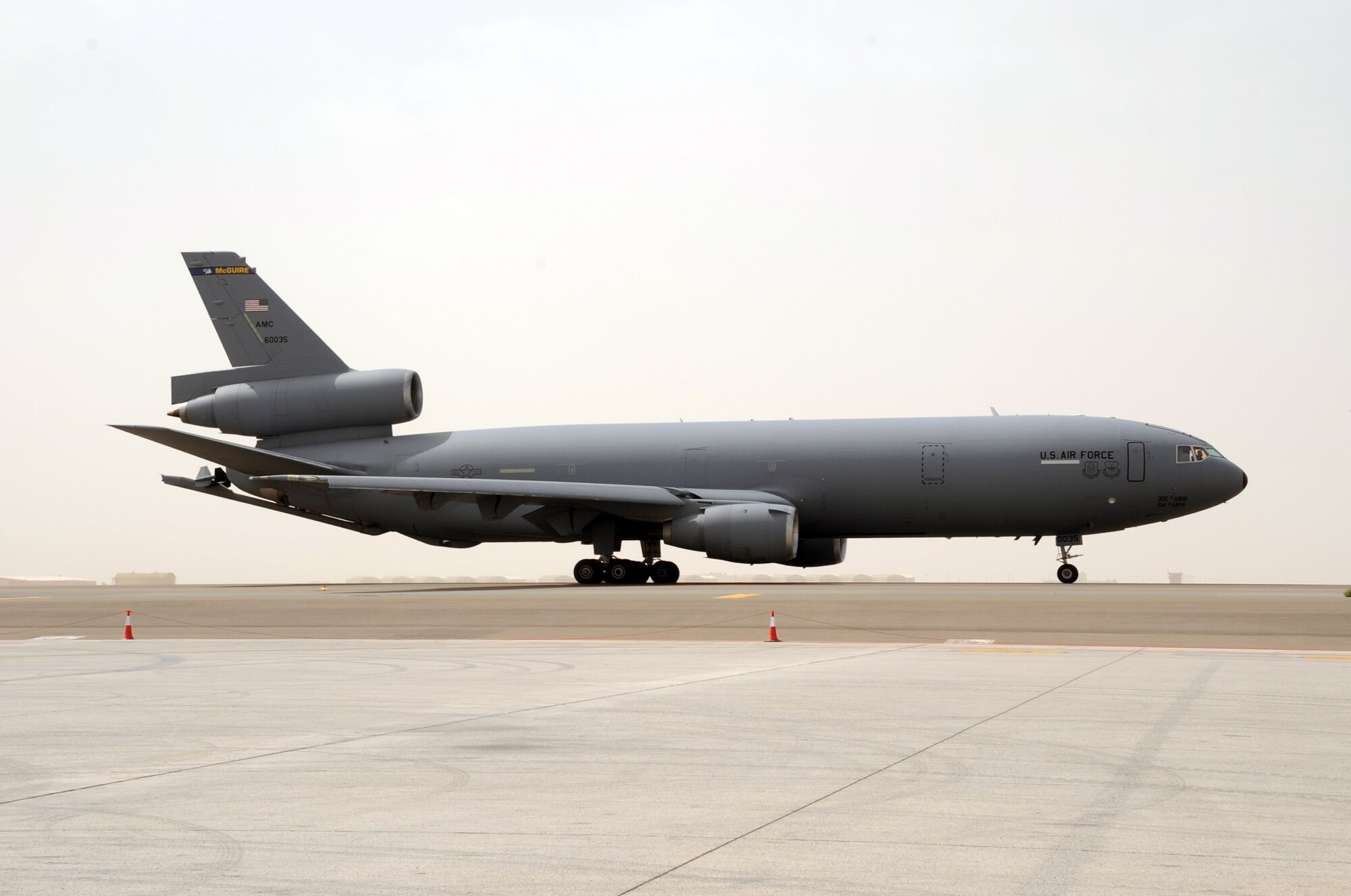 A flight crew drive a KC-10 Extender from the 908th Expeditionary Air Refueling Squadron down the taxiway en route to a mission during operations on the flightline for the 380th Air Expeditionary Wing at a non-disclosed base in Southwest Asia on March 1, 2010. The 380th AEW supports operations Iraqi Freedom and Enduring Freedom and the Combined Joint Task Force-Horn of Africa. (U.S. Air Force Photo/Master Sgt. Scott T. Sturkol/Released)