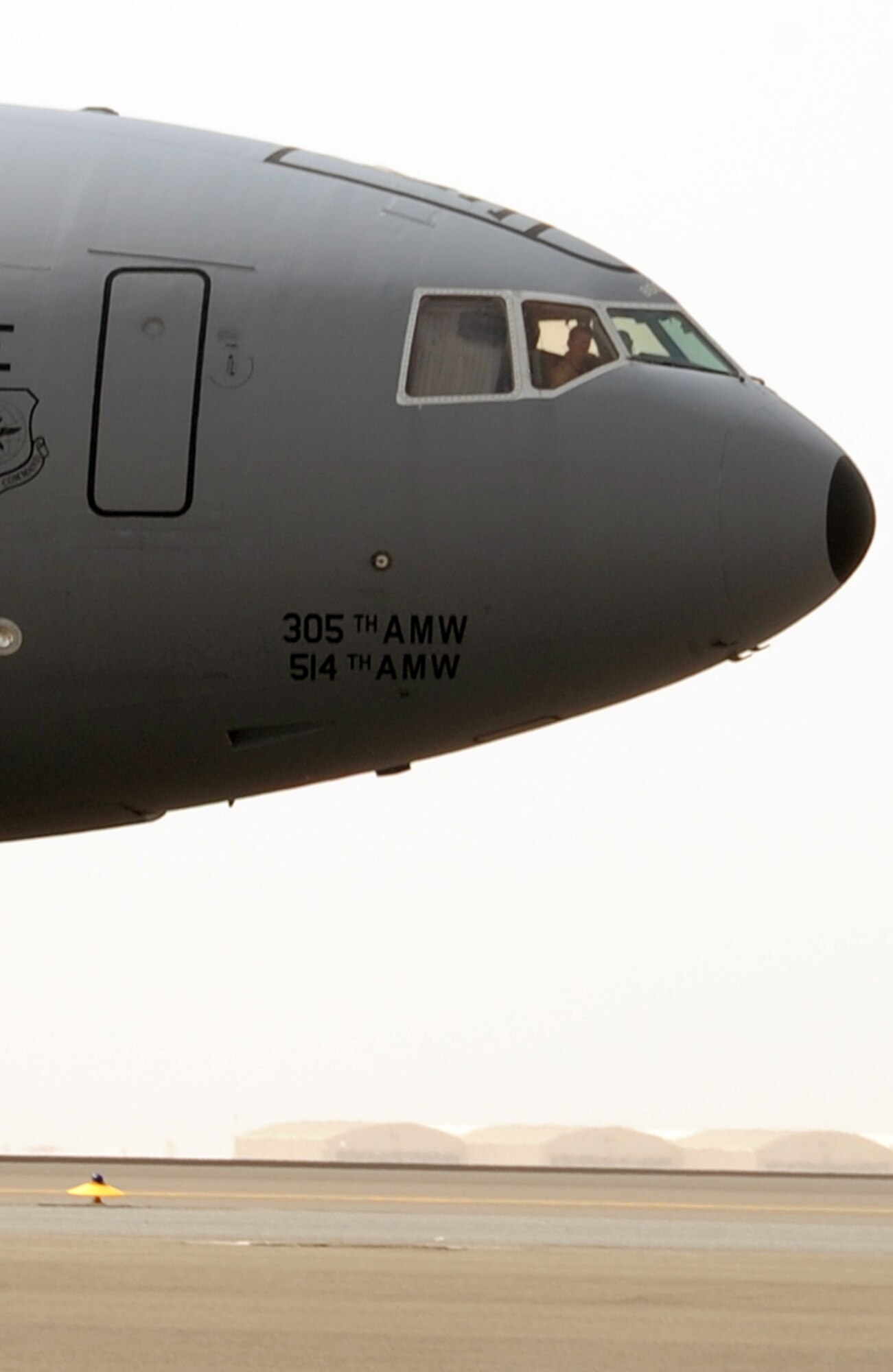 A flight crew drive a KC-10 Extender from the 908th Expeditionary Air Refueling Squadron down the taxiway en route to a mission during operations on the flightline for the 380th Air Expeditionary Wing at a non-disclosed base in Southwest Asia on March 1, 2010. The 380th AEW supports operations Iraqi Freedom and Enduring Freedom and the Combined Joint Task Force-Horn of Africa. (U.S. Air Force Photo/Master Sgt. Scott T. Sturkol/Released)