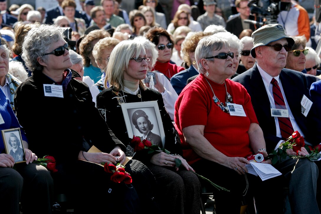 Cheryl Marie Michell Van Riper holds the photo of her aunt, Marie Mitchell, a deceased pilot who flew with the Women Airforce Service Pilots during World War II, during a wreath-laying and remembrance ceremony for all 1,102 pilots at the Air Force Memorial in Arlington, Va., March 9, 2010. The ceremony was part of a two-day event in which all pilots will receive the Congressional Gold Medal at the U.S. Capitol for their service.