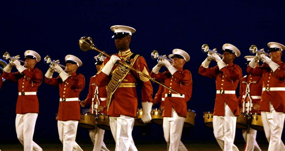 The Marine Corps Drum and Bugle Corps' drum master leads his Marines during a Marine Corps Battle Color Ceremony March 12 on Bordelon Field, Camp H.M Smith, Hawaii. The event was the first time the entire Marine Corps Battle Color Detachment had been in Hawaii.