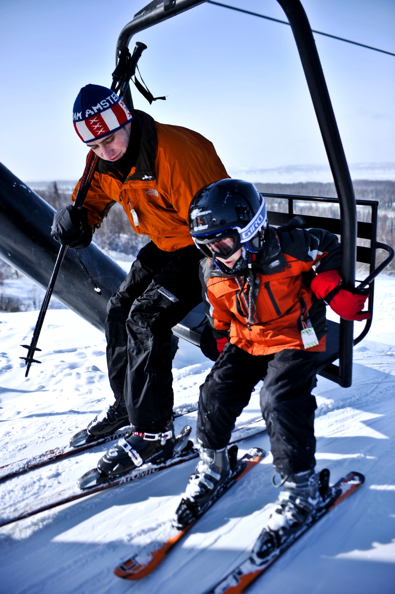 ELMENDORF AIR FORCE BASE, Alaska – Two skiers prepare themselves to get off the lift at Hillberg ski area March 11. March 8-12 was spring break for most of the schools in and around Elmendorf, giving children and their parents the opportunity to get out and enjoy themselves. (Air Force photo/Airman 1st Class Christopher Gross)