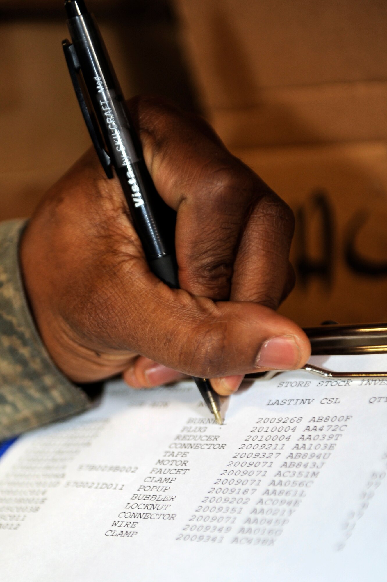 SCOTT AIR FORCE BASE, Ill -- Airman 1st Class Jamaul Anderson, 375th Civil Engineer Squadron, Material Acquisitions warehouse clerk, checks off an item on his list during an inventory, March 12, 2010 at Scott. Airman Anderson accounts for approximately 15 items every day to ensure that a complete warehouse inventory is accomplished every year. (U.S. Air Force photo/ Senior Airman Wesley Farnsworth)