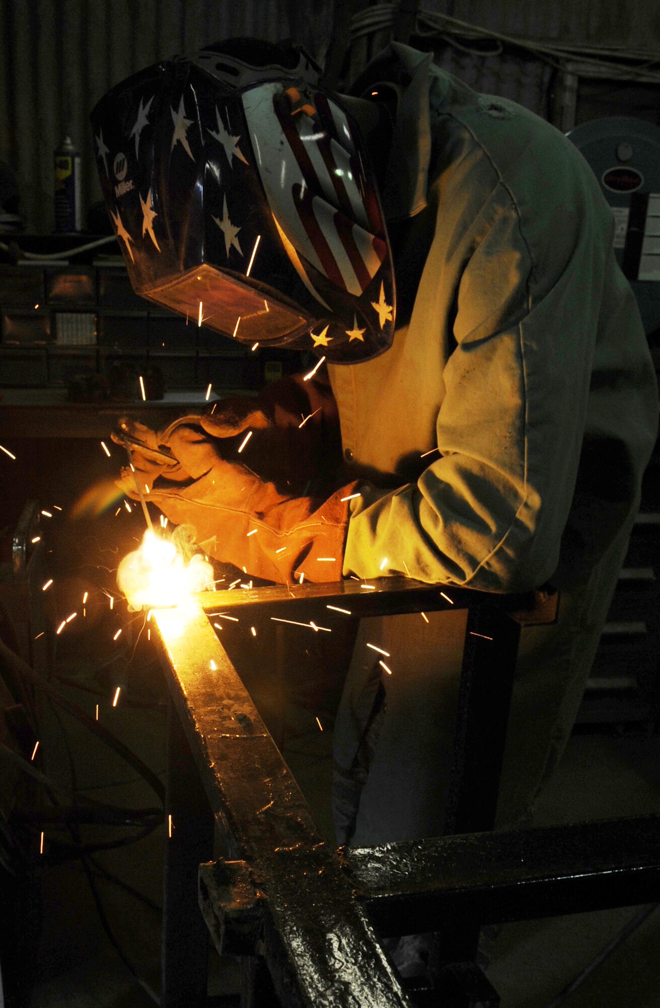 Tech. Sgt. Anthony Williams welds together a school desk for local children on March 6, 2010, at Kirkuk Regional Air Base, Iraq. Sergeant Williams is a structures craftsman assigned to the 506th Expeditionary Civil Engineer Squadron. (U.S. Air Force photo/Staff Sgt. Tabitha Kuykendall)