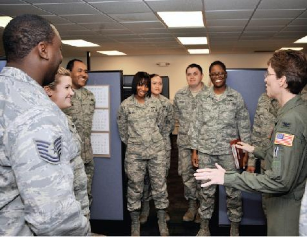 Colonel Jacqueline D. Van Ovost, 89th Airlift Wing commander, right, speaks with Airmen from the 316th Force Support Squadron military personnel flight March 9, 2010, on Joint Base Andrews, Md. Colonel Van Ovost, who assumed command of the 89 AW Feb. 12, visited 316th Wing units to learn more about their mission and to meet Airmen in the workplace. (Air Force photo by Airman 1st Class Perry Aston)