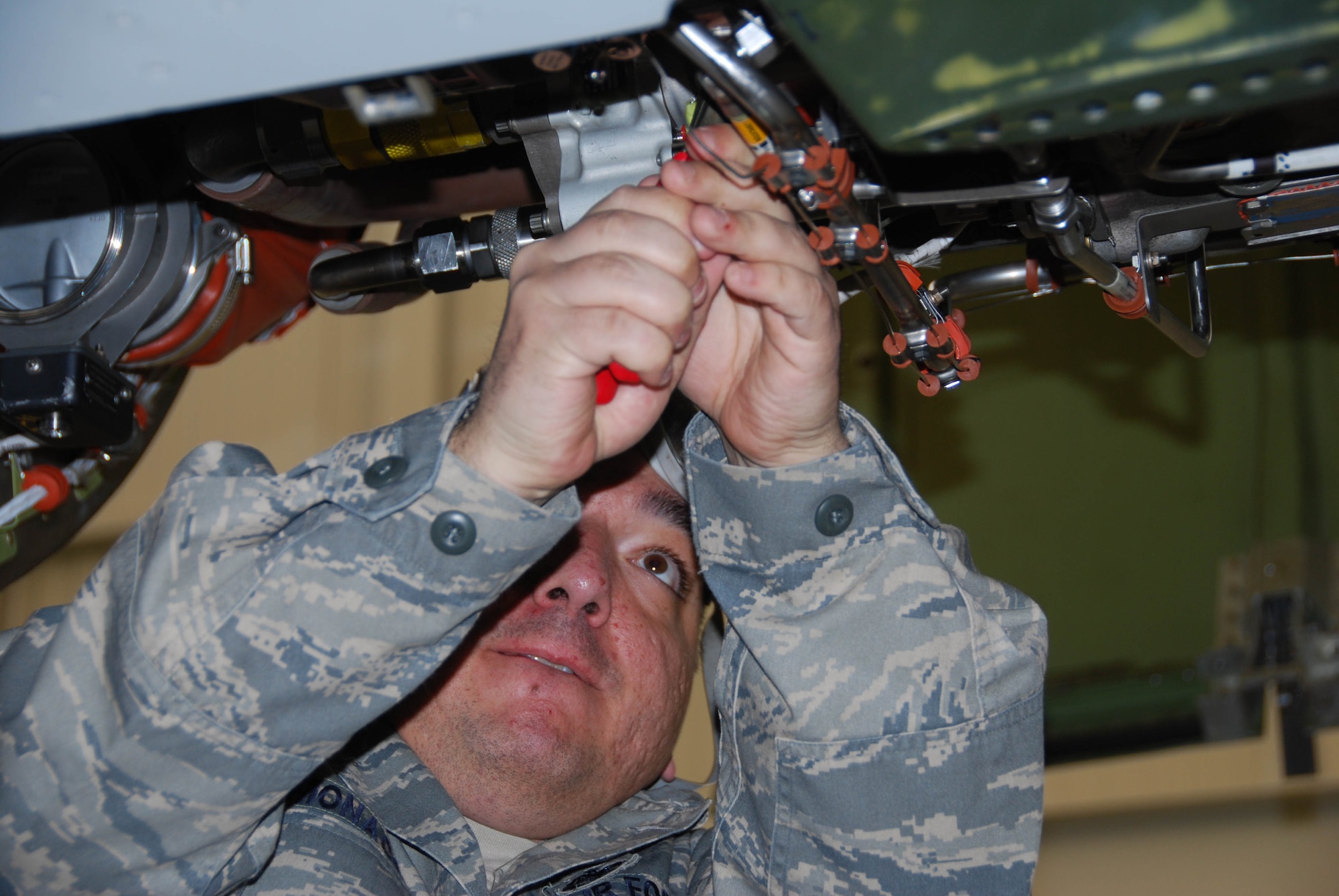 JOINT BASE MCGUIRE-DIX-LAKEHURST, N.J. - Tech. Sgt. Louis Monaco, a Reserve electrical environmental aircraft systems specialist here, is timed while practicing on a jet engine in preparation for the upcoming AMTSociety Maintenance Competition. The competition is set for March 15-18 in Las Vegas, NV, and will showcase 25 maintenance teams from across the U.S. in 12 events vying for first place honors. (U.S. Air Force photo/Master Sgt. Donna T. Jeffries)
