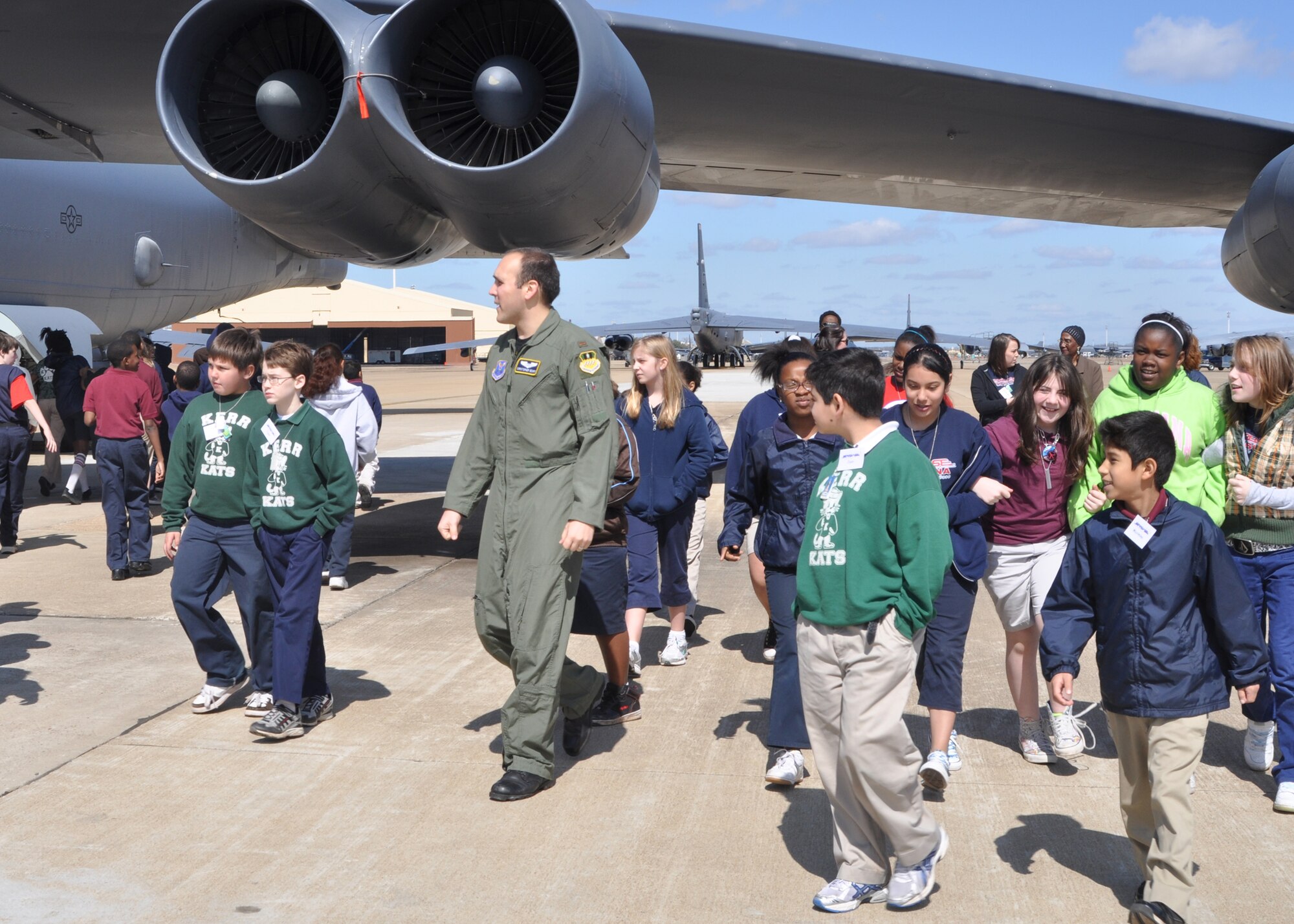 2nd Lt. Christopher Geary, a B-52 Stratofortress navigator with the 93rd Bomb Squadron on Barksdale Air Force Base, La., briefs a group of students from Starbase during a B-52 static display on Barksdale March 12, 2010. Starbase, sponsored by the 917th Wing on Barksdale, motivates students and promotes education through math, science, technology and engineering courses.  (U.S. Air Force Photo/Senior Airman Crystal Marie Jordan)