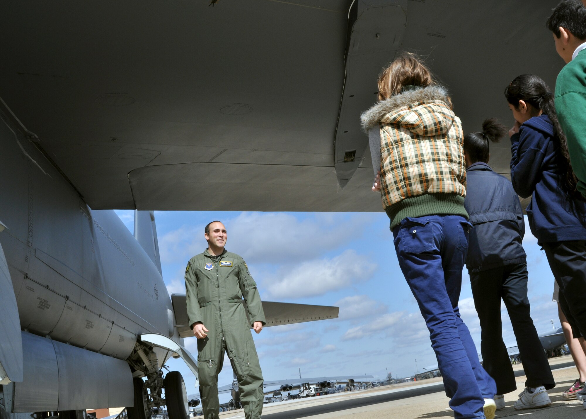 2nd Lt. Christopher Geary, a B-52 Stratofortress navigator with the 93rd Bomb Squadron on Barksdale Air Force Base, La., briefs a group of students from Starbase during a B-52 static display on Barksdale March 12, 2010. Starbase, sponsored by the 917th Wing on Barksdale, motivates students and promotes education through math, science, technology and engineering courses.  (U.S. Air Force Photo/Senior Airman Crystal Marie Jordan)