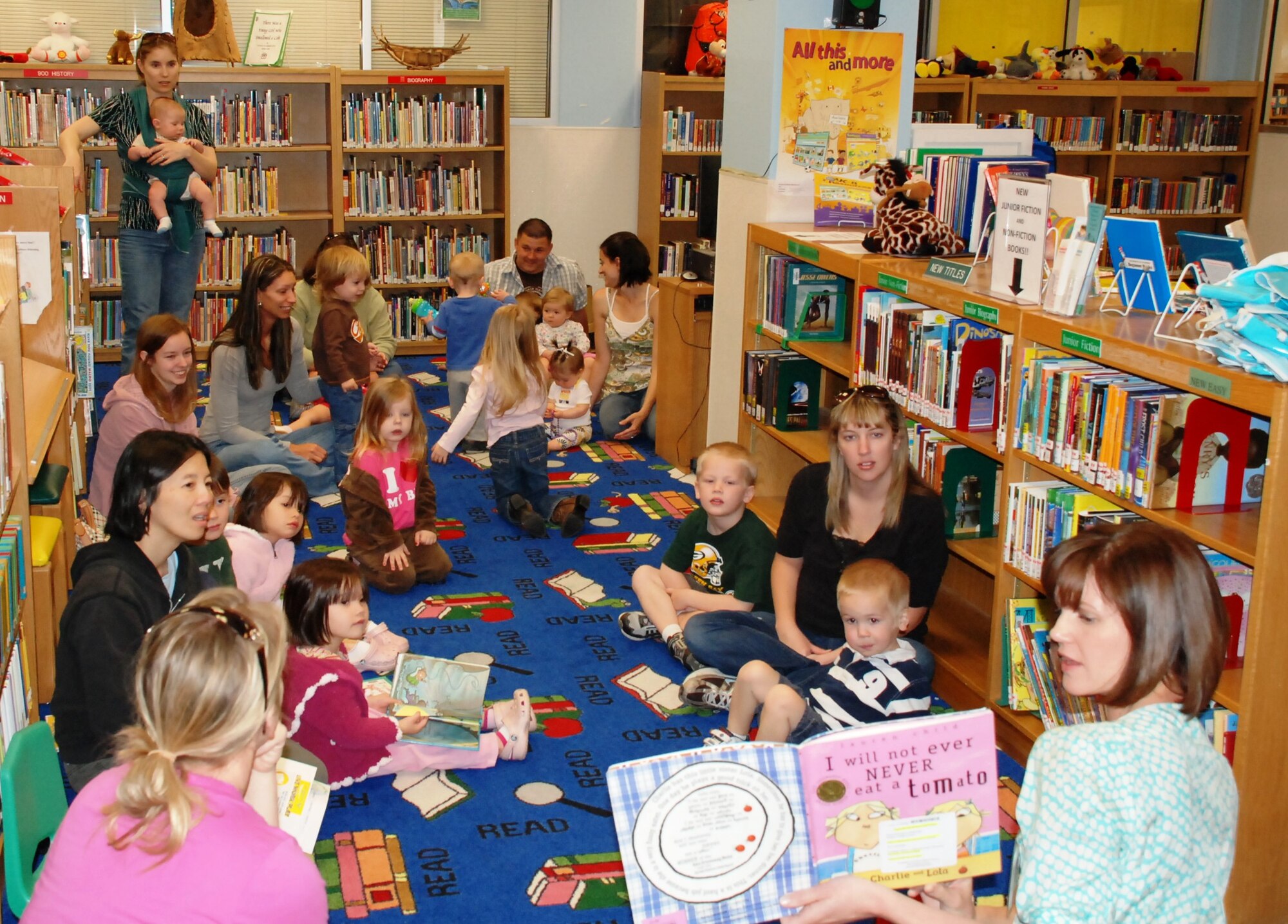 LAUGHLIN AIR FORCE BASE, Texas – Stacee Smith, Laughlin’s Health and Wellness Center dietician, reads a nutrition-themed book to a group of children and their parents at Laughlin’s library March 12 in recognition of National Nutrition Month. Various events are scheduled to be held throughout March to promote nutrition, including a cooking demonstration at Laughlin’s HAWC March 16. (U.S. Air Force photo by Airman 1st Class Blake Mize)