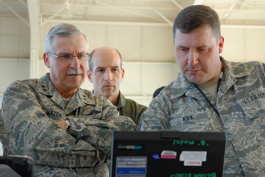 During a visit to the 940th Wing, Maj. Gen. Martin Mazick, Vice Commander of Air Force Reserve Command, observes a diagnostic check on the RQ-4 systems conducted by Tech. Sgt. Thomas Kirk, 13th Reconnaissance Squadron avionics technician, as Colonel Jeffrey Mineo, 940th Wing Commander, looks on.  General Mazick visited Beale Air Force Base, Calif., home of the RQ-4 Global Hawk, on March 10, 2010. 