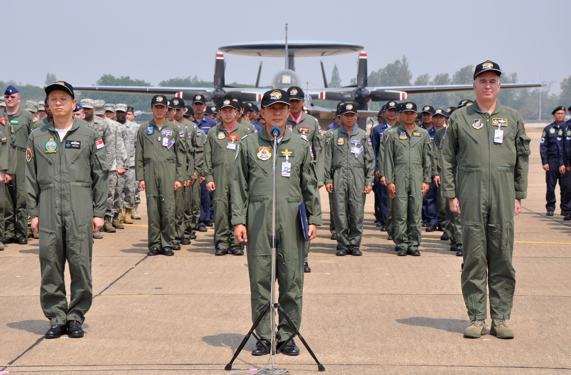 The Singaporean, Thai and U.S. exercise directors for Cope Tiger 2010 await the start of the exercise’s closing ceremony at Korat Royal Thai Air Force Base, Thailand, March 12. Cope Tiger is an annual multilateral exercise involving aviation and ground units from the U.S. Air Force, the Royal Thai Air Force and Army, and the Republic of Singapore Air Force. This year’s exercise was held March 1 to 12 at Korat and Udon Thani Royal Thai Air Force Bases. (U.S. Air Force photo/Capt. Christy Stravolo)