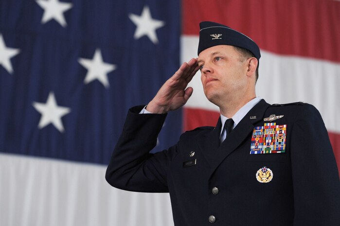 NELLIS AIR FORCE BASE, Nev --   Col. Steve Garland renders his first salute as the 99th Air Base Wing commander during the change of command ceremony held at the Thunderbird hangar March 12. (U.S. Air Force photo by Tech. Sgt. Michael R. Holzworth)
