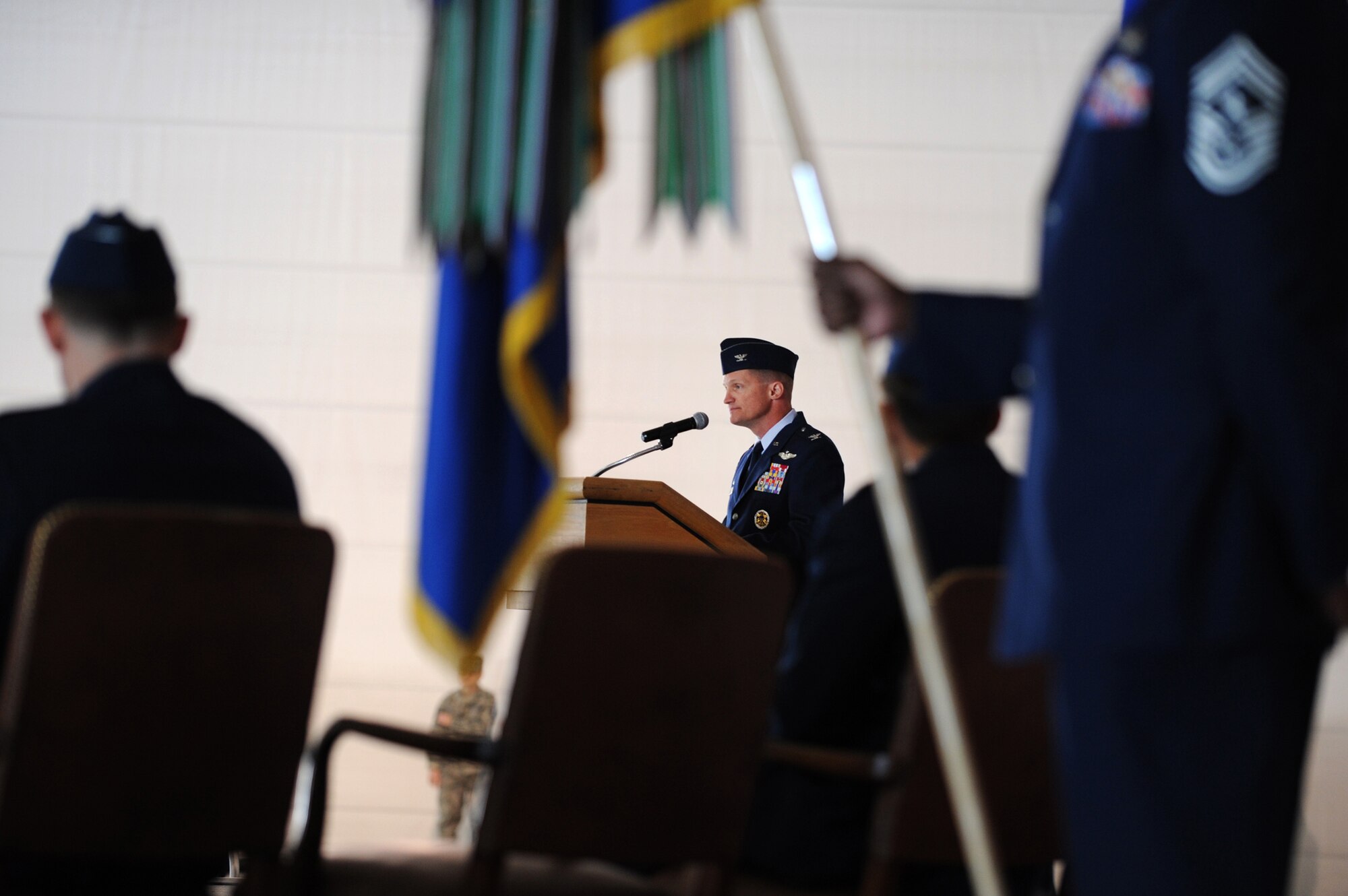 NELLIS AIR FORCE BASE, Nev --   Col. Dave Belote speaks to the men and women of the 99th ABW for the last time as their commander during the change of command ceremony held at the Thunderbird hangar March 12. (U.S. Air Force photo by Tech. Sgt. Michael R. Holzworth)