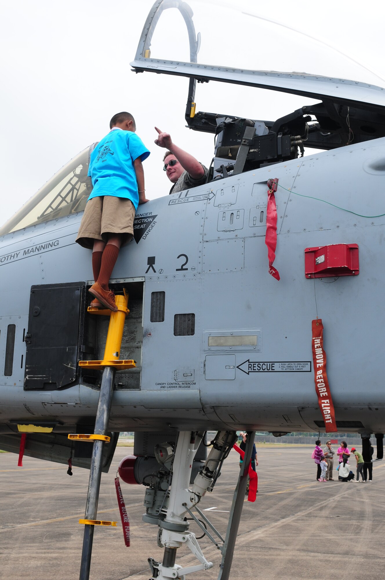 Senior Airman Ian Johnson explains the A-10 Thunderbolt II instrument panel to a Thai student during the Cope Tiger 2010 open house held for more than 50 Thai students March 10 at Udon Thani Royal Thai Air Force Base, Thailand. Airman Johnson is deployed to the exercise from the 25th Aircraft Maintenance Unit at Osan Air Base, South Korea. (U.S. Air Force photo/Capt. Genieve David)