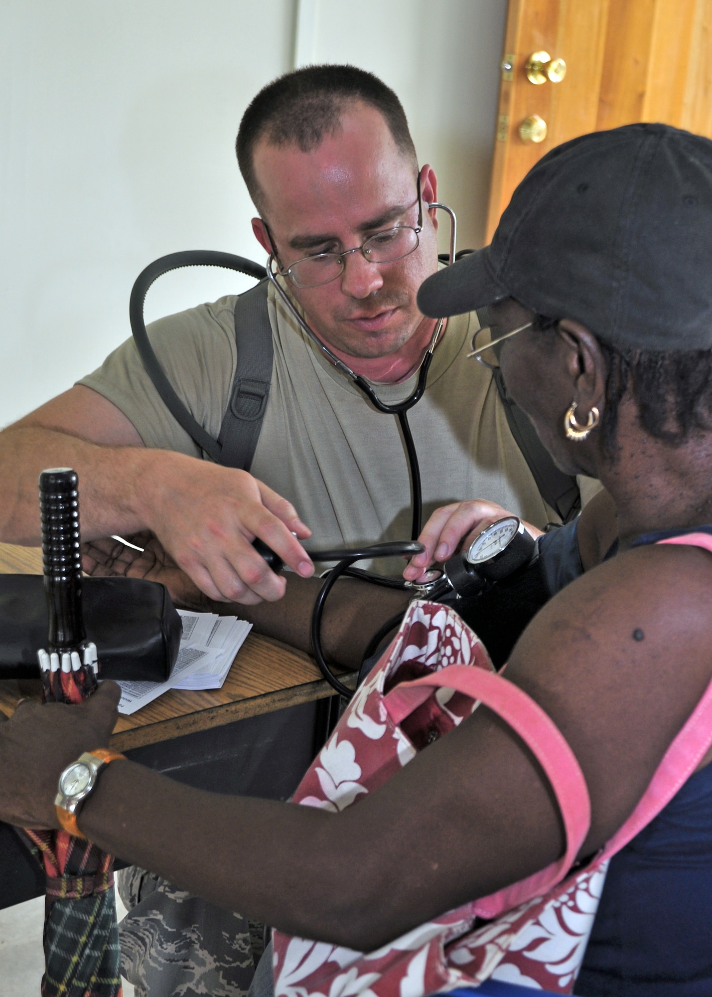 Capt. David Bradley checks blood pressure during a training mission to the villages of St. Margaret's and Armenia March 3, 2010, in Belize. The joint U.S. and Belize team saw more than 630 patients with medical issues ranging for colds to strokes. Captain Bradley is a Joint Task Force-Bravo medical element nurse. (U.S. Air Force photo/Staff Sgt. Bryan Franks)